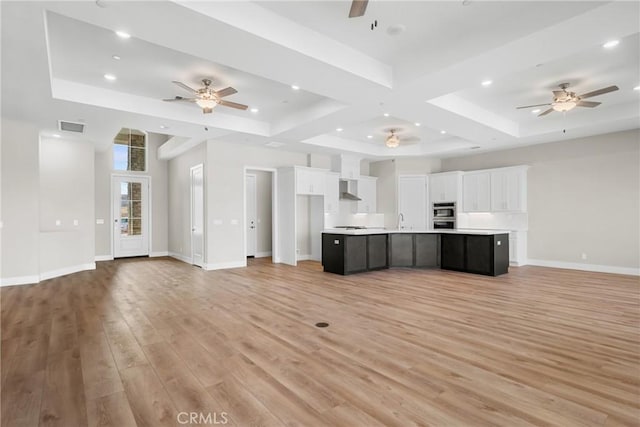 26176 Boulder View Ct, Menifee, CA 92584 - unfurnished living room featuring ceiling fan, light wood-type flooring, recessed lighting, a raised ceiling, and coffered ceiling