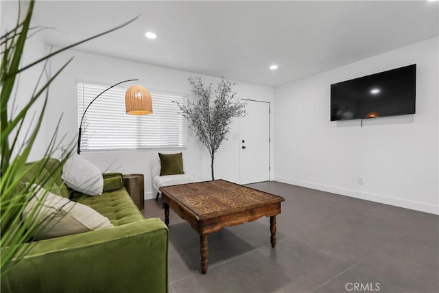 living room featuring concrete flooring