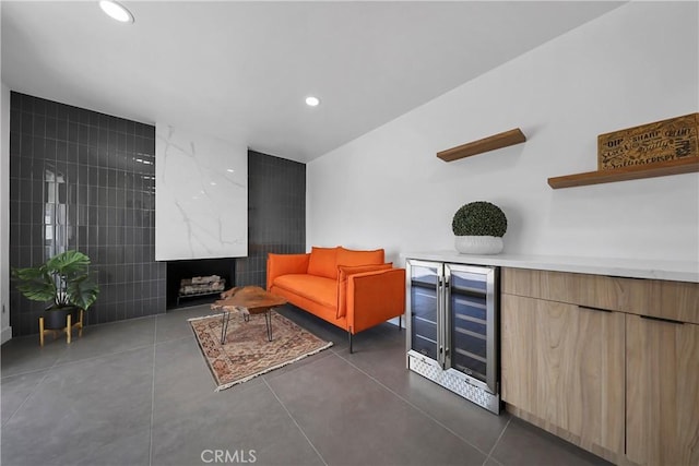 living room with bar, tile walls, and wine cooler