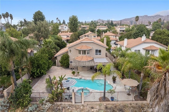 view of pool featuring a mountain view and a patio area