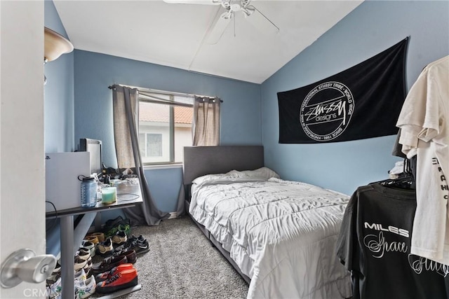 bedroom with ceiling fan, carpet floors, and vaulted ceiling