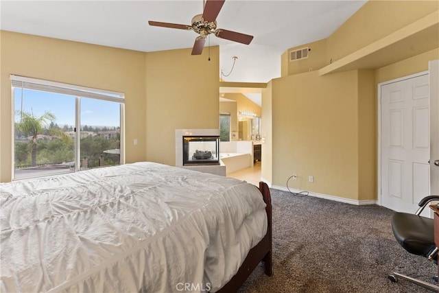 bedroom with carpet, ceiling fan, and ensuite bathroom