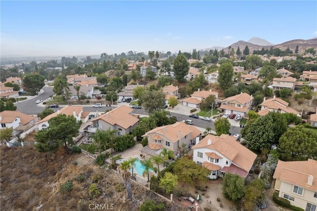 birds eye view of property featuring a mountain view