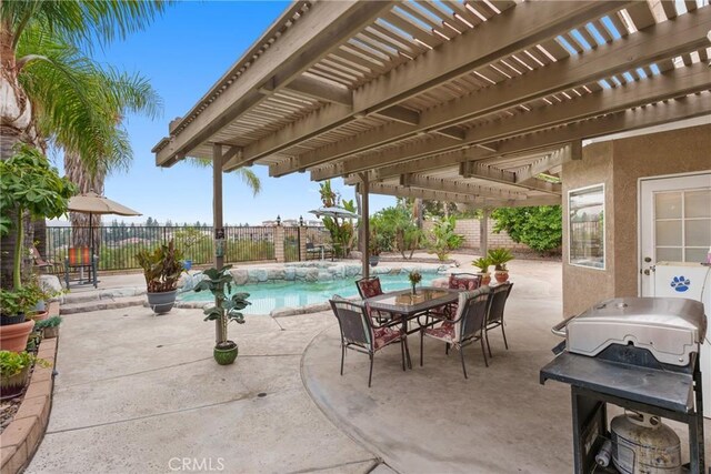 view of patio / terrace featuring a fenced in pool, a pergola, and grilling area