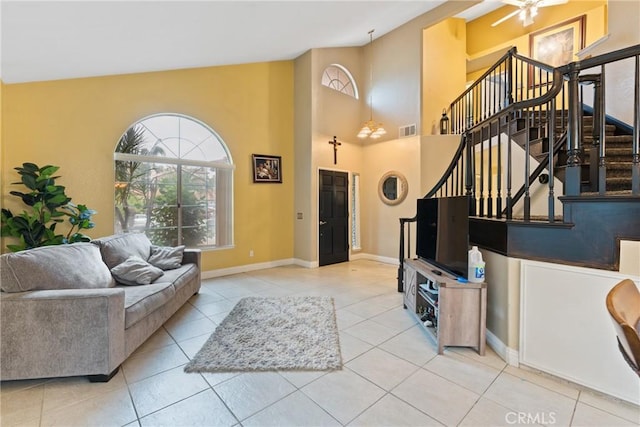 tiled living room featuring ceiling fan