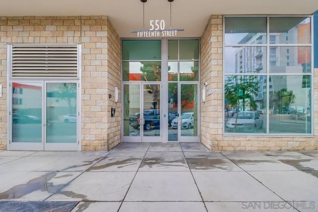 view of exterior entry featuring french doors