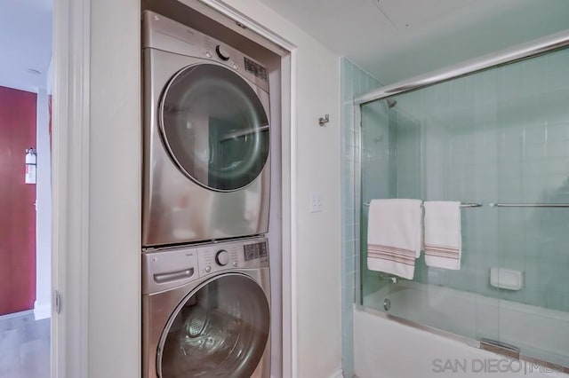 clothes washing area with stacked washer / drying machine