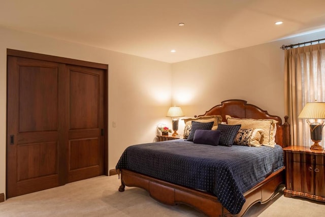 bedroom featuring light carpet