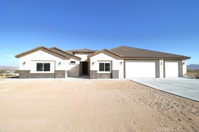 view of front of property with a garage