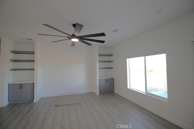 unfurnished living room with light hardwood / wood-style flooring and ceiling fan