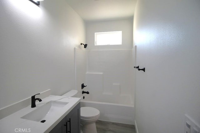 full bathroom with hardwood / wood-style floors, vanity, toilet, and bathing tub / shower combination