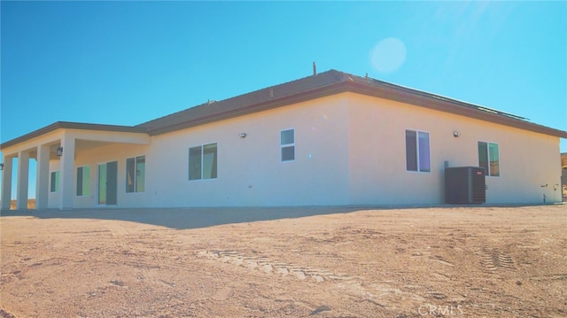 back of house with cooling unit