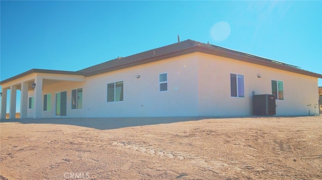 view of home's exterior with cooling unit