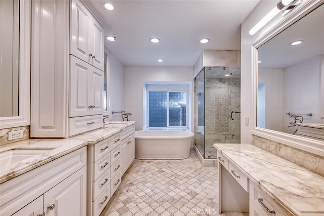 bathroom featuring vanity and separate shower and tub