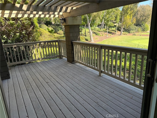 wooden terrace with a pergola and a yard