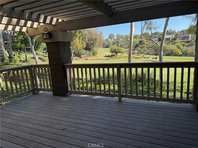 wooden terrace featuring a pergola and a yard