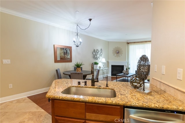 kitchen featuring sink, dishwasher, hanging light fixtures, crown molding, and dark hardwood / wood-style floors