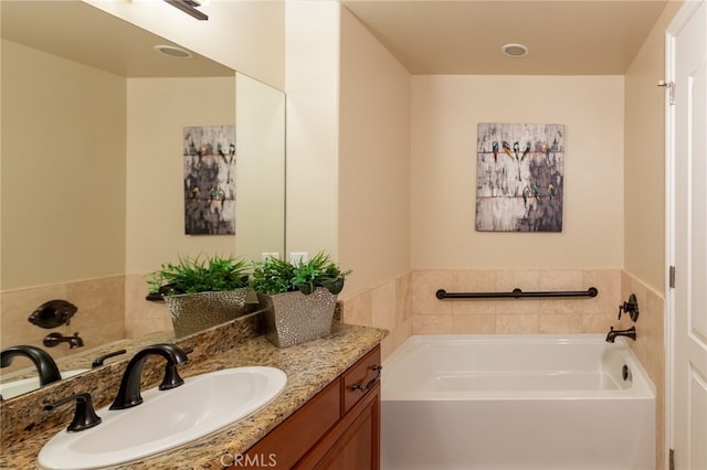 bathroom featuring vanity and a bathtub