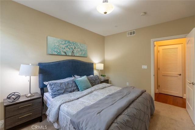 bedroom with light colored carpet