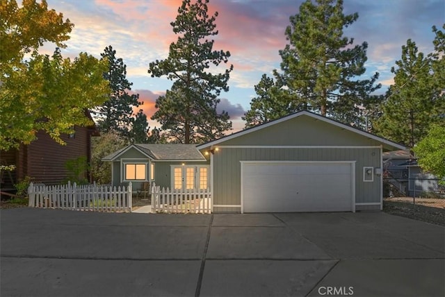 ranch-style house featuring a garage