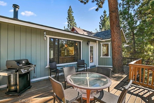 wooden terrace with area for grilling