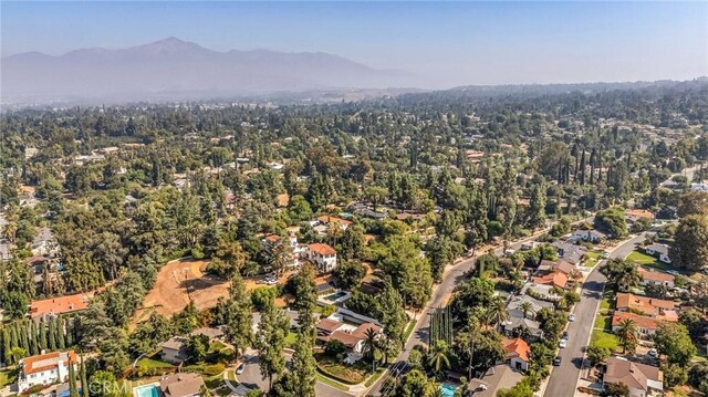 1317 Pacific St, Redlands, CA 92373 - aerial view of property and surrounding area featuring mountains and nearby suburban area