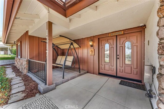 1317 Pacific St, Redlands, CA 92373 - entrance to property featuring board and batten siding and covered porch