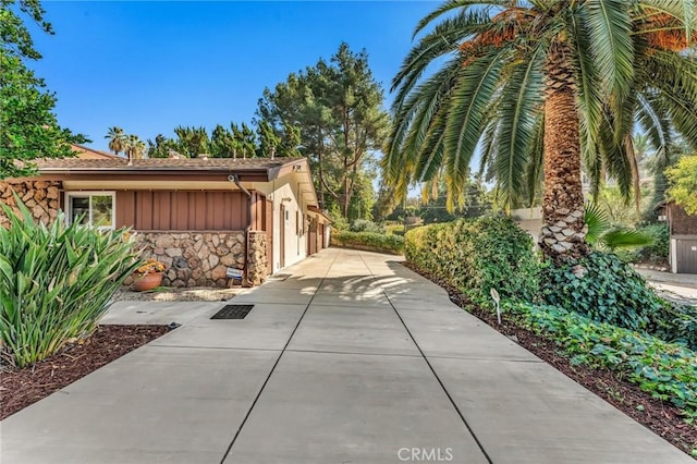 1317 Pacific St, Redlands, CA 92373 - view of home's exterior with stone siding, board and batten siding, and driveway