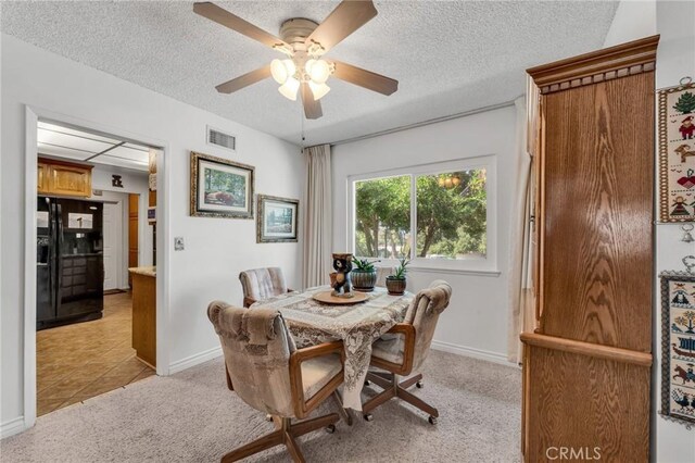 1317 Pacific St, Redlands, CA 92373 - dining room featuring light colored carpet, ceiling fan, baseboards, and a textured ceiling