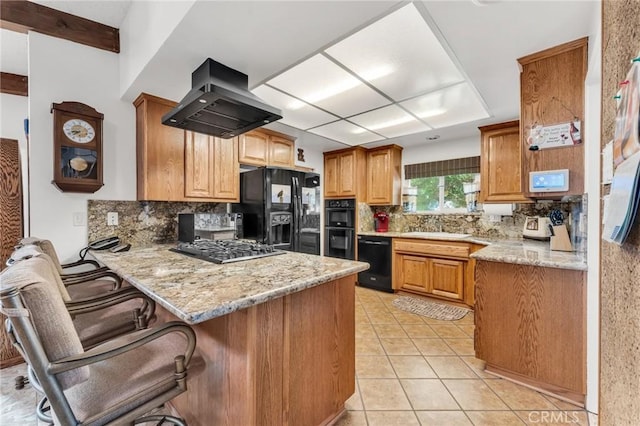 1317 Pacific St, Redlands, CA 92373 - kitchen featuring black appliances, extractor fan, a peninsula, and backsplash