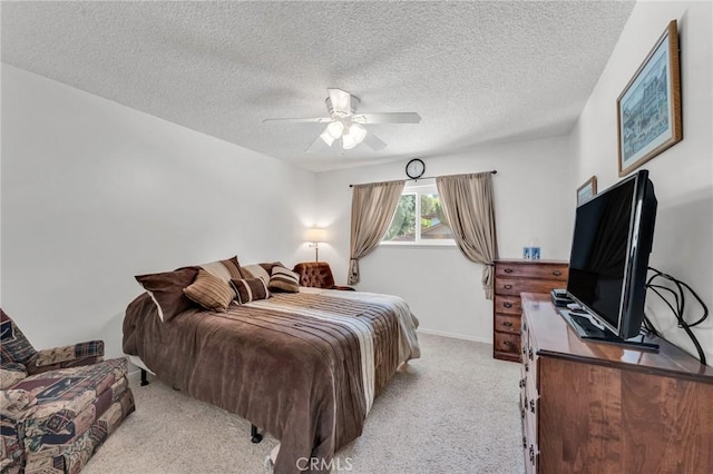 1317 Pacific St, Redlands, CA 92373 - bedroom featuring light colored carpet, a textured ceiling, baseboards, and a ceiling fan