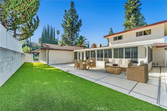 1317 Pacific St, Redlands, CA 92373 - rear view of property featuring stucco siding, an outdoor hangout area, a patio area, and a sunroom