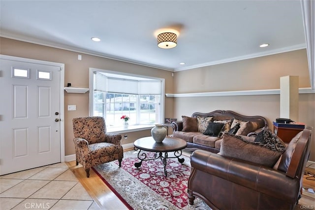 living room featuring crown molding and light hardwood / wood-style flooring