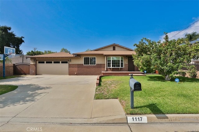 ranch-style home featuring a front lawn and a garage