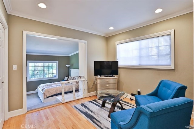 bedroom featuring ornamental molding and hardwood / wood-style floors