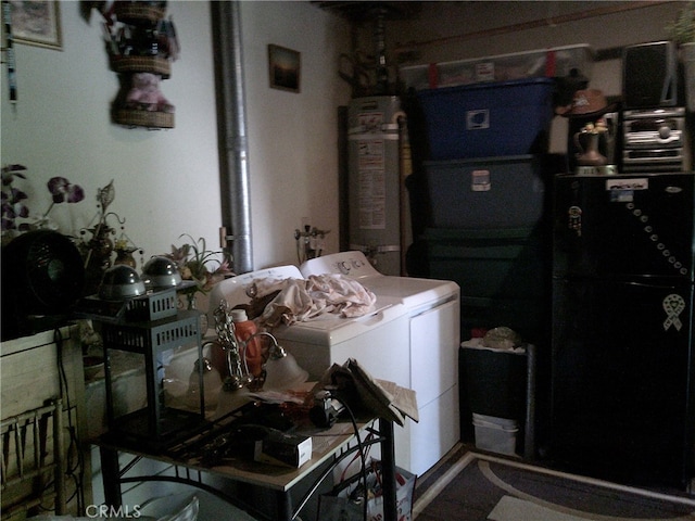 washroom featuring independent washer and dryer and water heater