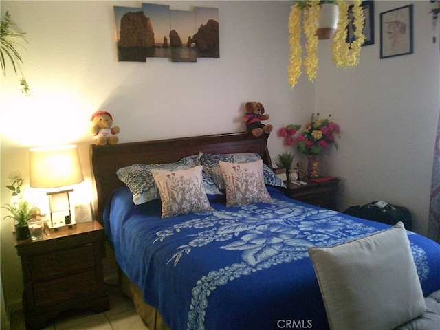 bedroom featuring tile patterned flooring