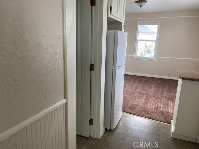 corridor with carpet floors