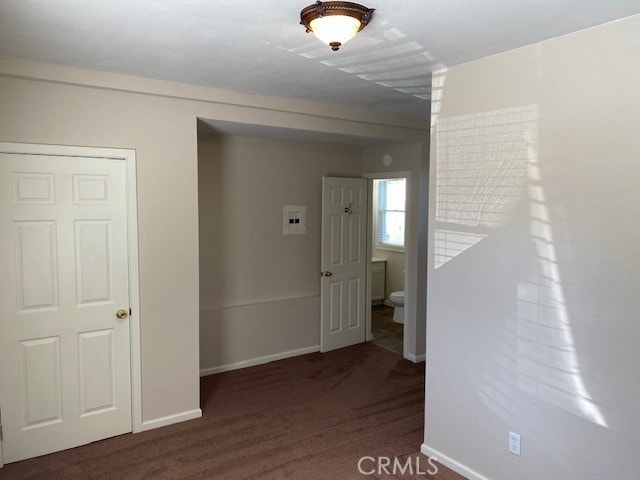 interior space with dark carpet