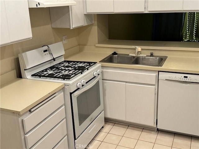 kitchen featuring white appliances, light tile patterned flooring, range hood, white cabinets, and sink