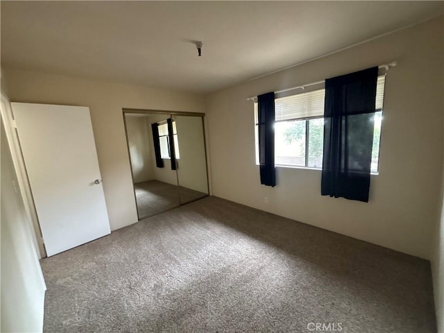 unfurnished bedroom featuring carpet flooring