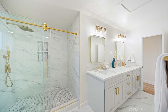 bathroom featuring vanity and a shower with door