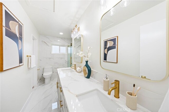 bathroom featuring vanity, toilet, tiled shower, and tile walls