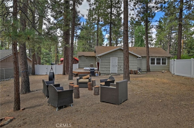 rear view of property featuring a patio and outdoor lounge area