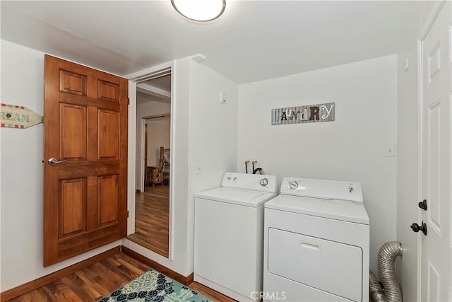 laundry room with hardwood / wood-style flooring and separate washer and dryer