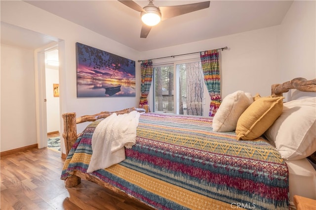 bedroom featuring hardwood / wood-style flooring and ceiling fan