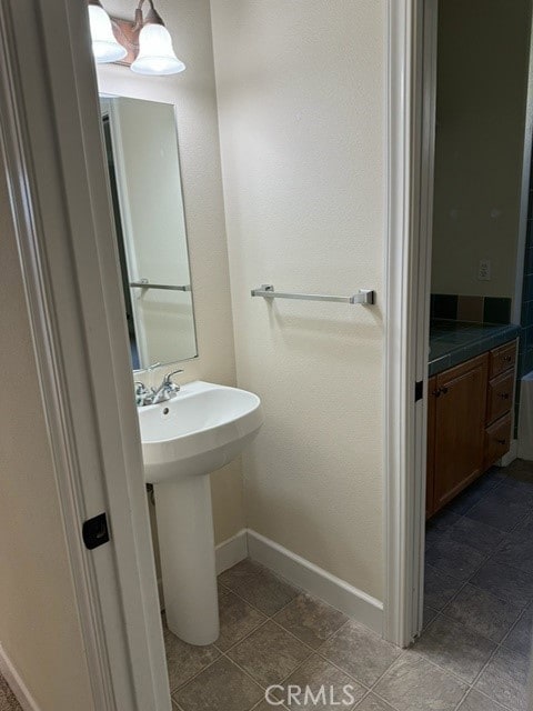 bathroom with tile patterned floors and sink