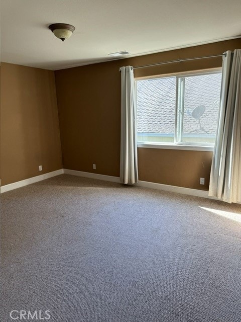 spare room featuring carpet flooring