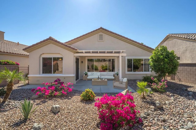 back of property with a patio and outdoor lounge area