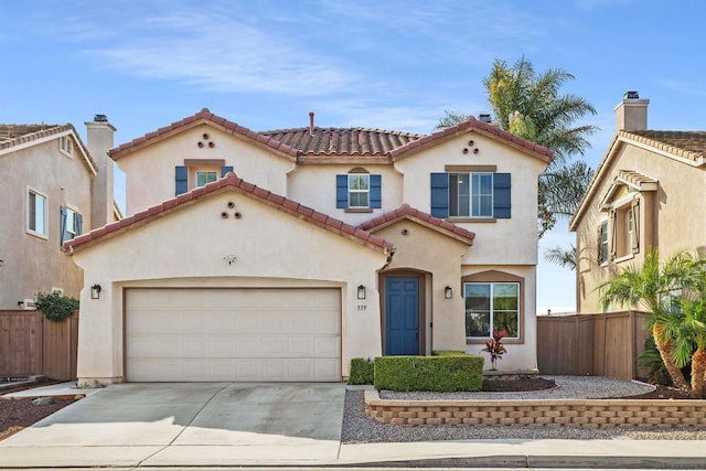 mediterranean / spanish-style home featuring a garage